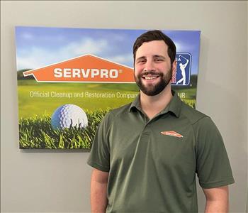 A male SERVPRO employee is shown in a golf shirt with SERVPRO logo