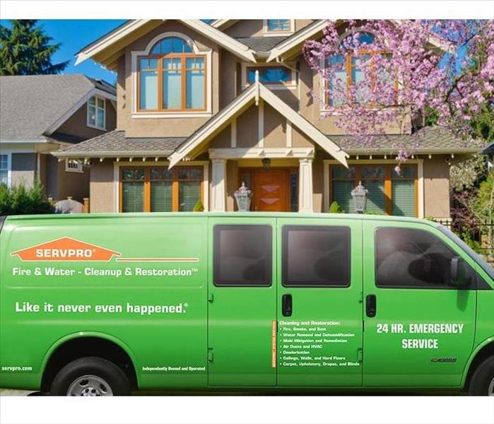 SERVPRO green van in front of a home. 