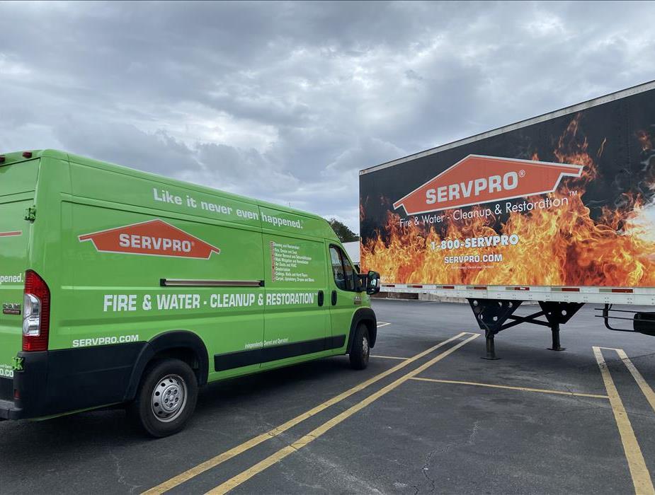 Green van and back of flame semi truck