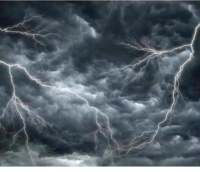 Lightning is shown in a dark sky